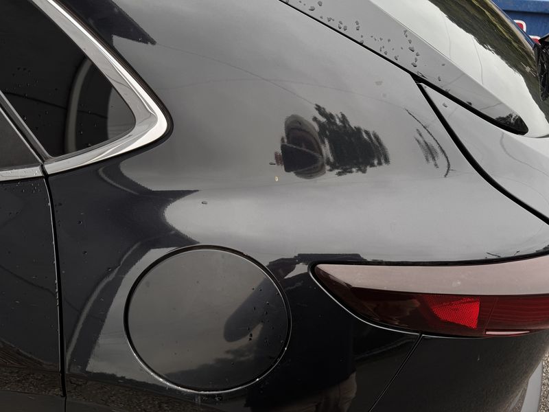 Rear quarter panel before the wash.