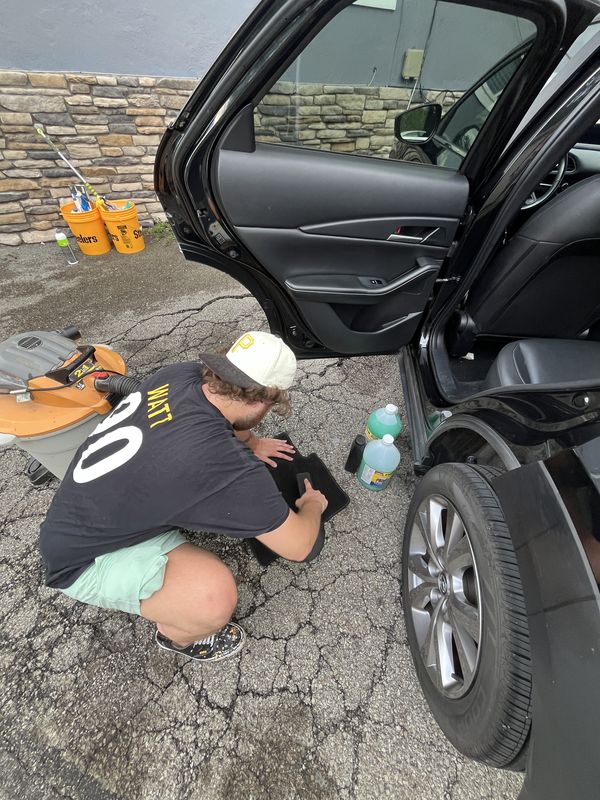 Cleaning the rear door sill.