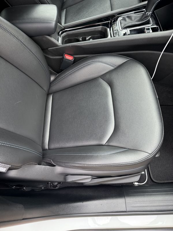 Driver seat and center console after detailing.