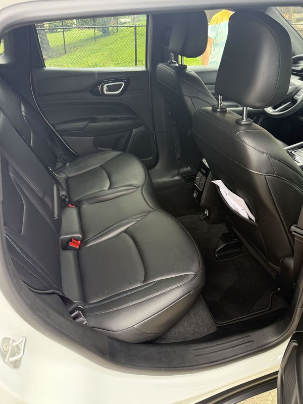 Rear seat and floor after detailing, seen through the open door.