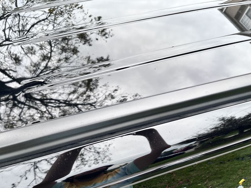 Gloss black roof reflecting the sky.