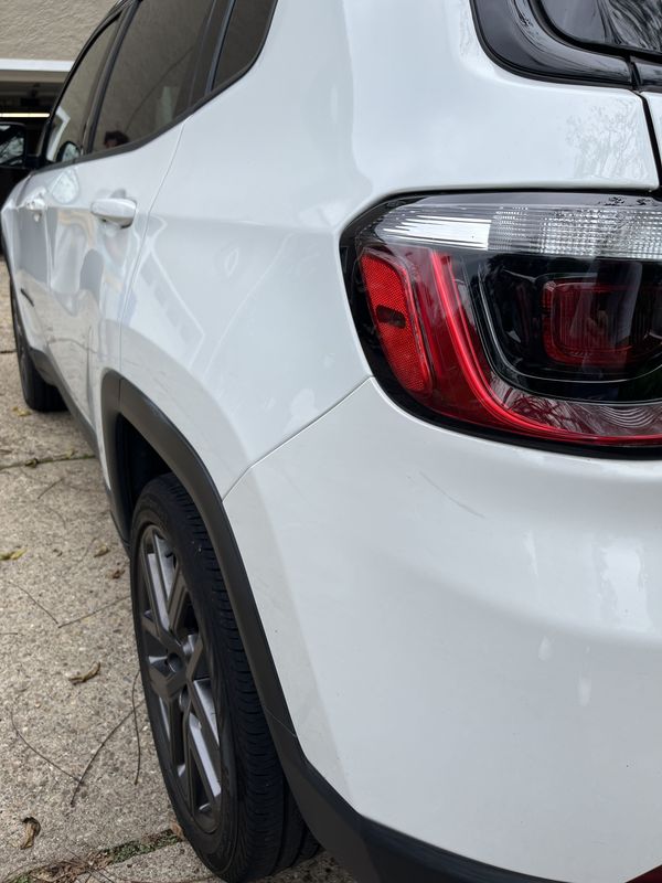 Rear quarter and taillight before the wash.