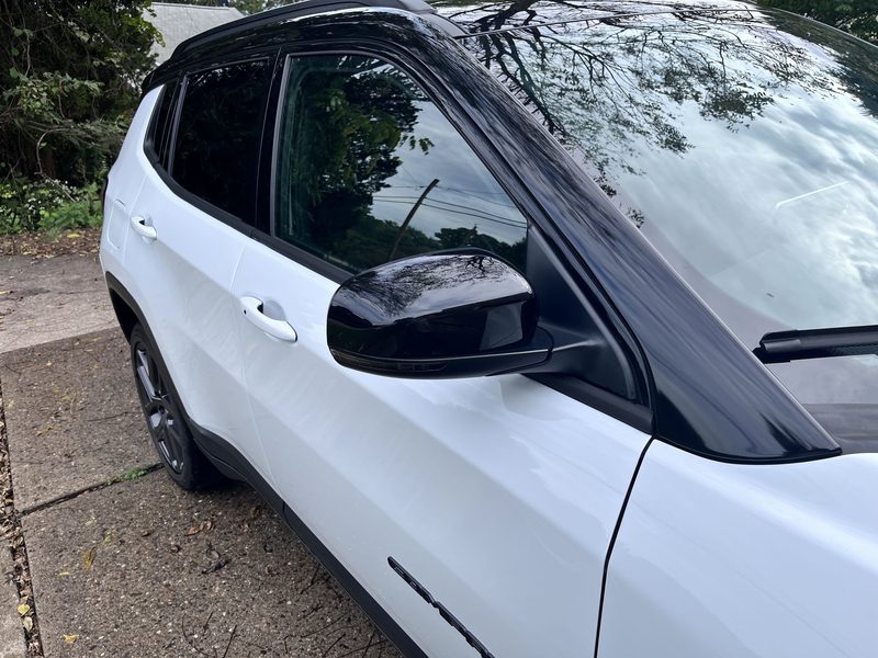 Driver side mirror, glass and roofline after the wash.